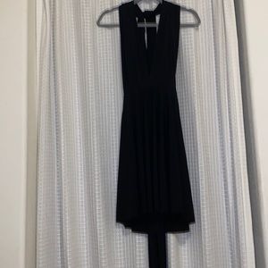 Cute and classy black dress. Open back and adjustable straps.